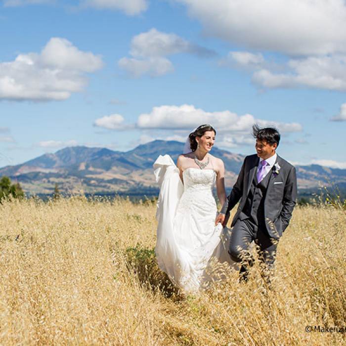 wedding picture of couple in an open field